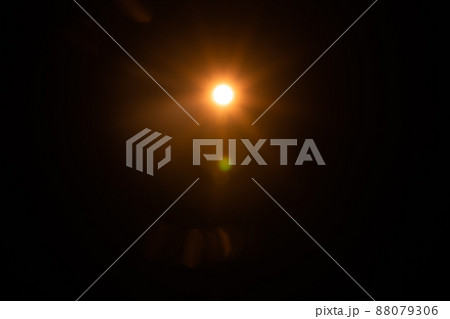 Solar lens flare on black background Solar lens flare on black background 88079306