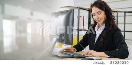 Business people wearing headset working in office broaden view Business people wearing headset working in office broaden view 88080050