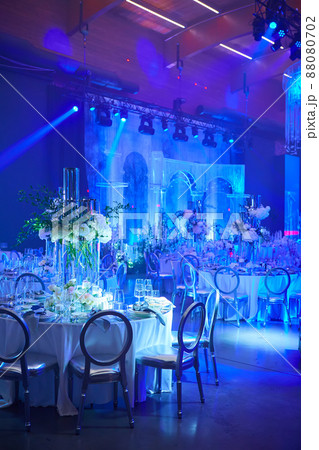 Table setup in blue light. Ready to event. Table setup in blue light. Ready to event. 88080702