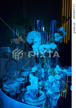 Table setup in blue light. Ready to event. Table setup in blue light. Ready to event. 88080717