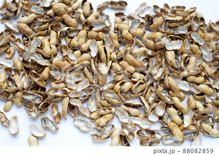 Peanut shells on white background. Peanut shells on white background. 88082859