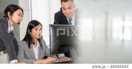 Business people wearing headset working in office broaden view Business people wearing headset working in office broaden view 88086892