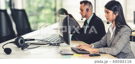 Business people wearing headset working in office broaden view 88088116