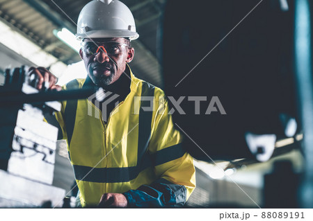 Factory worker or engineer do machine job in adept manufacturing workshop 88089191