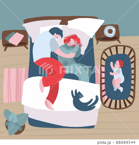 Parents sleep in bed and newborn in the cradle nearby. Parents sleep in bed and newborn in the cradle nearby. 88089544