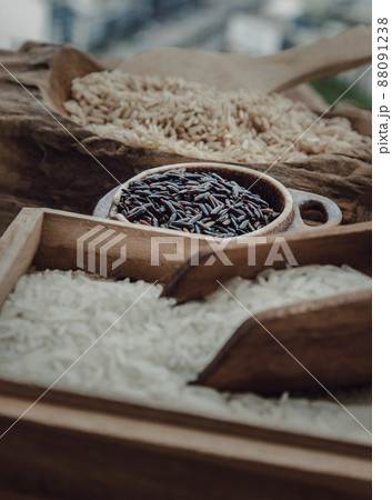 Various types of rice : Brown rice, Jasmine rice, Riceberry on old wooden background. Organic raw rice collection, Healthy food and diet concept, Selective focus. Various types of rice : Brown rice, Jasmine rice, Riceberry on old wooden background. Organic raw rice collection, Healthy food and diet concept, Selective focus. 88091238