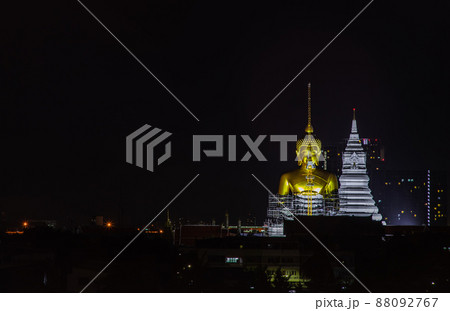Aerial view of Beautiful The Giant Golden Buddha in Wat Paknam Phasi Charoen Temple in Phasi Charoen district at night. 88092767
