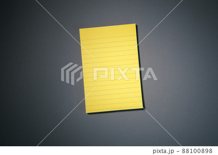 yellow sticky paper on grey 88100898