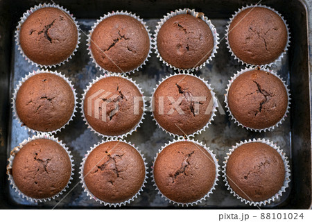 Chocolate cupcake in baking cloth. Top view. Homemade bakery 88101024