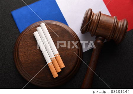 Flag of France, cigarettes and Judge gavel top view. Tobacco control act. government duty. Justice and Tobacco law. 88101144