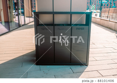 recycling and garbage concept. Modern trash container for metal, glass and plastic waste sorting on city street 88101406