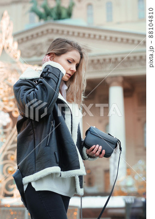 blond girl with long hair in black leather jacket closeup street portrait blond girl with long hair in black leather jacket closeup street portrait 88104810