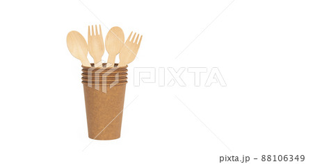 Eco brown cup and wooden fork, spoon on a white background. Mockup for your and copy space 88106349