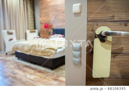 An empty sign on the hotel door handle for your text An empty sign on the hotel door handle for your text 88106395