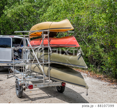 Minivan with four kayaks in trailer Minivan with four kayaks in trailer 88107399