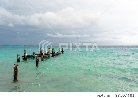 Remains of an old pier on Playa Caracol beach in Cancun, Mexico 88107481