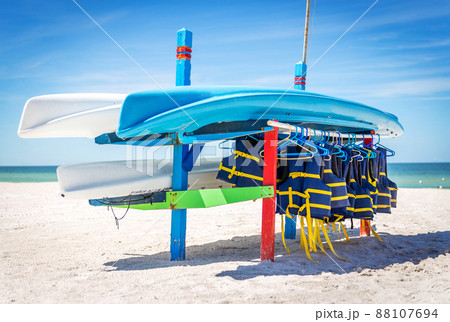Life jackets and boats on St.Pete beach in Florida, USA. Life jackets and boats on St.Pete beach in Florida, USA. 88107694
