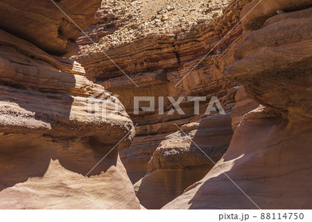 An amazing place in Israel is called the Red canyon and Nahal Shani, Southern District. Totally worth visiting because of its stunning stony structure  88114750