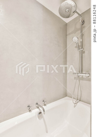 Interior of modern bathroom with bathtub and shower Interior of modern bathroom with bathtub and shower 88116248