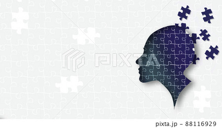 Cutout silhouette of a human head containing brain made from puzzle pieces, revealing thinking concept 88116929