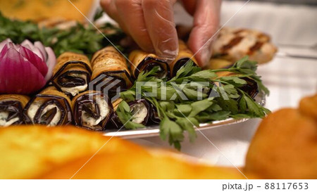 Georgian cuisine. Eggplant rolls. Eggplant rolls with walnut and garlic. Georgian cuisine. Eggplant rolls. Eggplant rolls with walnut and garlic. 88117653