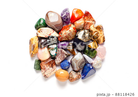 Mineral stones on a white background. The concept of using minerals and crystals in astrology and alternative or complementary medicine. Copy space. Mineral stones on a white background. The concept of using minerals and crystals in astrology and alternative or complementary medicine. Copy space. 88118426