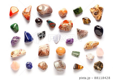 Mineral stones on a white background. The concept of using minerals and crystals in astrology and alternative or complementary medicine Mineral stones on a white background. The concept of using minerals and crystals in astrology and alternative or complementary medicine 88118428