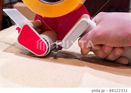 Packing the box with scotch tape dispenser Packing the box with scotch tape dispenser 88122331