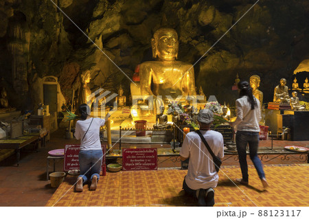 Phetchaburi, Thailand - November 11, 2018 : The golden Buddha inside Khao Luang Cave in Phetchaburi,Thailand on November 11, 2018. 88123117
