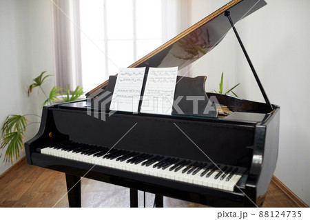 Grand piano with sheet music in the classroom Grand piano with sheet music in the classroom 88124735