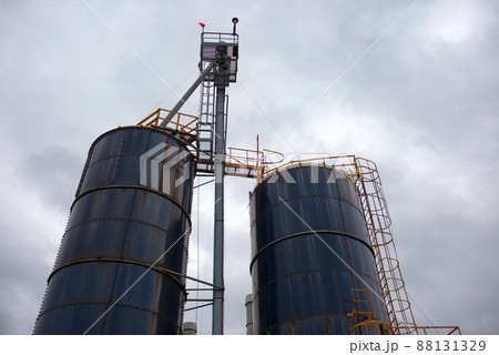 industrial silo storage factory building container cloudy sky 88131329