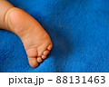 Baby legs on the bed 88131463