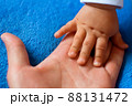 Hand of a child on a woman's palm 88131472