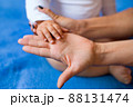 Hand of a child on a woman's palm 88131474