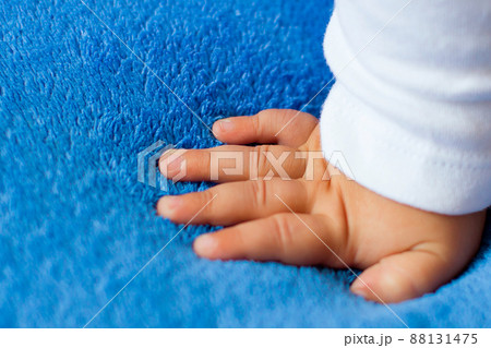 Child's hand on a blue veil,full hd video 88131475