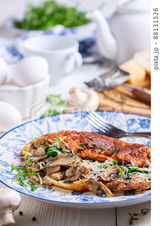 Omelet with mushrooms. 88131526
