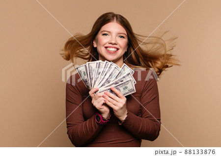 Cute woman with dollar fan Cute woman with dollar fan 88133876