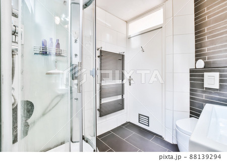 Magnificent bathroom with shower and black floor Magnificent bathroom with shower and black floor 88139294