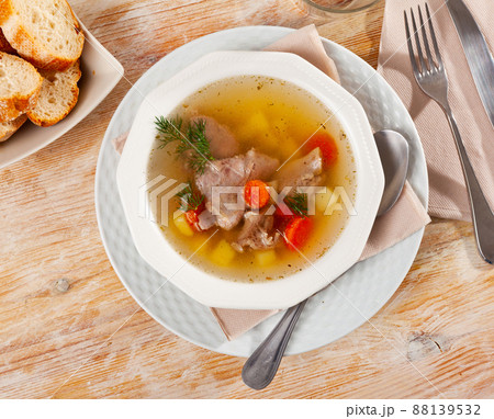 Homemade soup with pork meat on bone and vegetables Homemade soup with pork meat on bone and vegetables 88139532