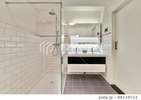 Modern bathroom with shower and double sink in a new house Modern bathroom with shower and double sink in a new house 88139533