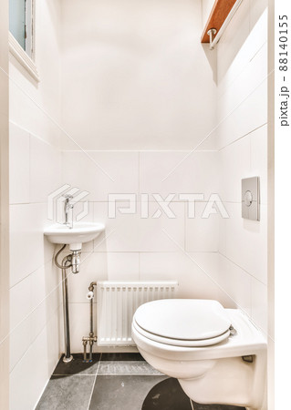 Charming toilet room design with hanging toilet and white tile Charming toilet room design with hanging toilet and white tile 88140155