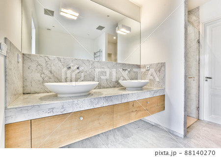 Double sink in modern stylish bathroom with walk-in shower Double sink in modern stylish bathroom with walk-in shower 88140270