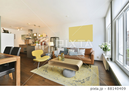 living room with bright furniture and casual leather sofa living room with bright furniture and casual leather sofa 88140409