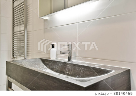 General view of the sink located under the mirror near the dryer in the bathroom General view of the sink located under the mirror near the dryer in the bathroom 88140469