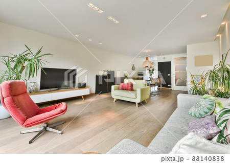 Living room interior with a dining area in a modeern apartment Living room interior with a dining area in a modeern apartment 88140838