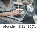 Personal Data Access and Technology Security for Business Financial. Business Woman Using Mobile While Accessing Private Data on Laptop. Technology Database Security Network System for Global Business 88141271