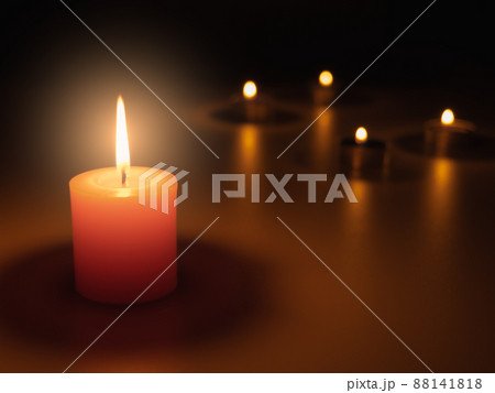 Light a candle in the dark, the flame warms and the light creates bokeh. Light and shadow create atmosphere. Things such as romantic, mysterious, interesting, and also make you feel faith. 88141818