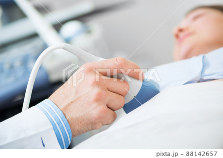 Doctor doing ultrasound screening checkup 88142657