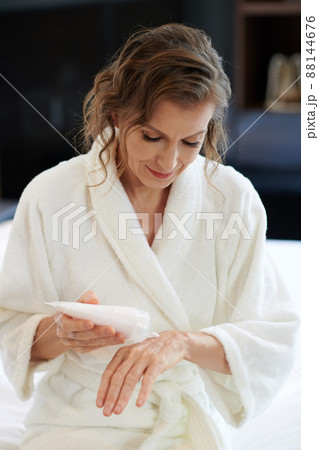 Mature Woman Applying Hand Cream 88144676