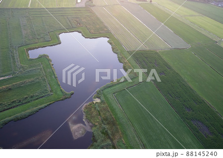 Agricultural landscape of Friesland, one of the northern provinces of the Netherlands - Friesland from above Agricultural landscape of Friesland, one of the northern provinces of the Netherlands - Friesland from above 88145240